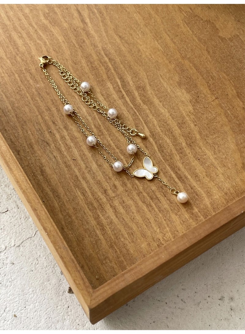 veya A Chic Anklet Adorned With A Shiny Butterfly And Elegant Artificial Pearls For A Soft Feminine Look. - Image 3